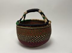 An African hand-woven basket with polychrome threads (h. 36cm)