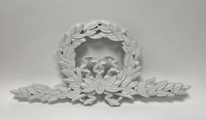 Ramsay Gillies, a distressed painted carved wooden wall hanging wreath with bow detail to centre (l.