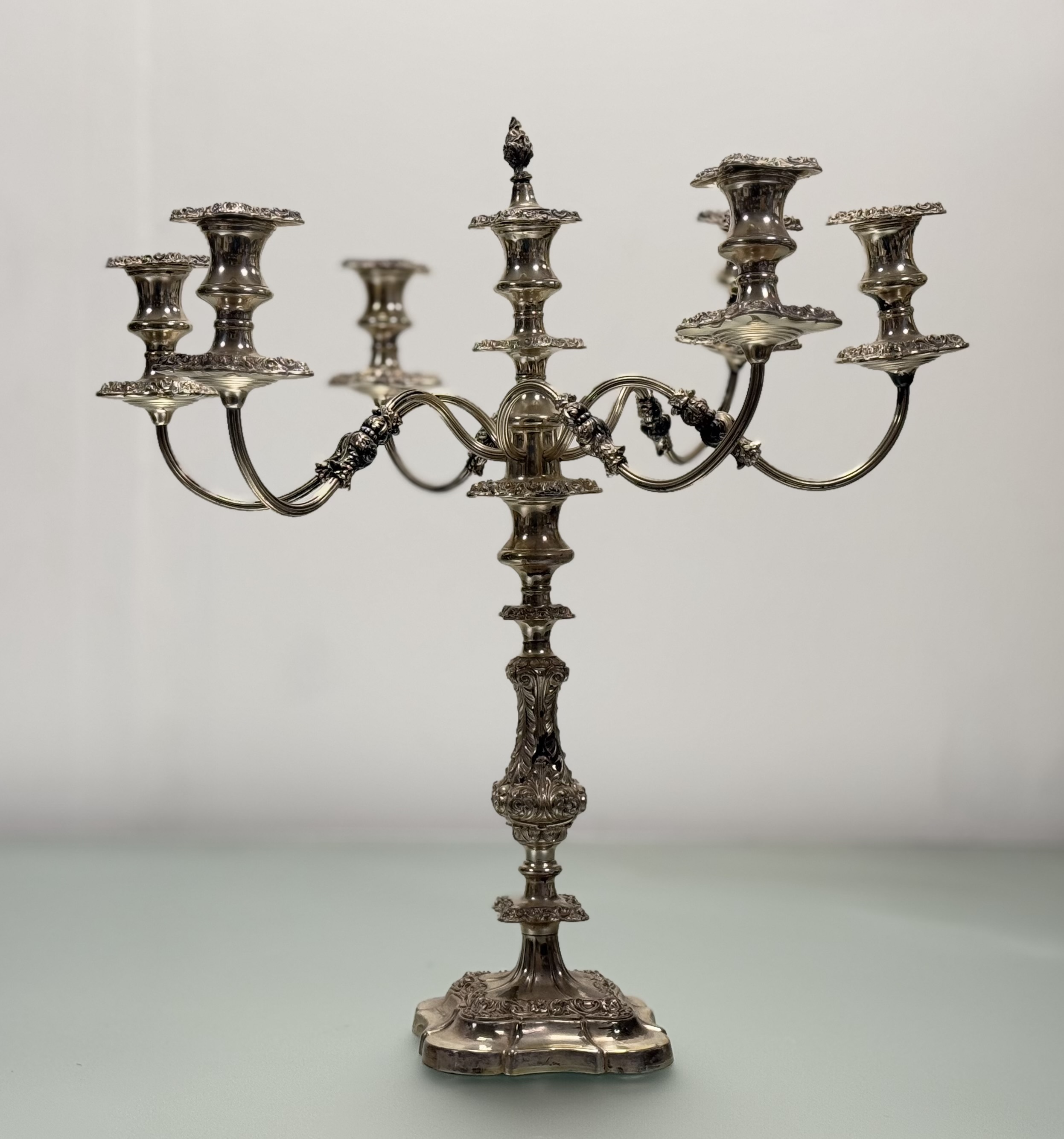 A substancial Victorian-style epns seven branch candelabra, the central baluster column with c
