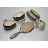 A London silver five-piece ribbon and floral swag engraved dressing set to include a hand mirror: l.