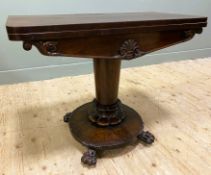 An early Victorian rosewood fold-over card table, rectangular top with rounded corners opening to