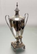 A 1920s Adam-style a two handled samovar with urn finial and plastic tap handle on square stepped