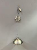 A contemporary brushed metal pulley wall light, with a suspended domed shade, untested