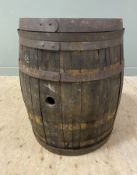 A vintage full-sized oak and metal-bound whisky barrel: h.x 86cm d.x 75cm