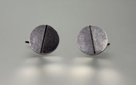 A pair of modern Danish Georg Jensen silver circular offset panel sleeve links with swivel torpedo