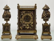 A three piece ornate clock set, the mantle clock with gold painted roman numeral clock face raised