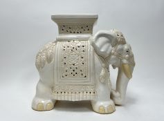 A cream glaze ceramic plant stand in the form of an elephant (h. 44cm)
