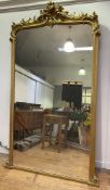 An impressive 19th century overmantle pier mirror, shaped top with heavily decorated scrolling