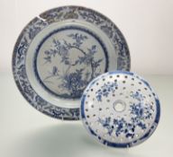 A 19thc Chinese blue and white porcelain charger painting with a flowering lotus and insect within a