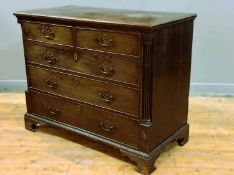 A good George III Cuban mahogany chest of small proportions, with crossbanded top, fitted two