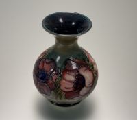 A Moorcroft Pottery bulbous vase, with anemones on green, marked verso. (h-15.5cm)