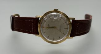 A Vintage 18ct gold Preximax manual wind wristwatch with silvered dial baton hour markers and second