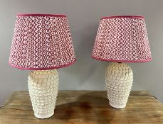 A pair of Pooky cream ceramic table lamps with moulded petal decoration, complete with a pair of