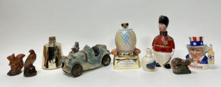 A mixed collection of whisky decanters comprising; a Beneagles Scotch Whisky 50ml sealed decanter in