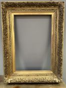 A large 19thc/early 20thc ornate gilt wood frame with scroll and acanthus carved border (interior