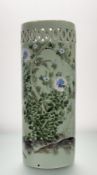 A late 19thc Chinese Celadon glaze umbrella stand, with blossoming flowering tree with birds