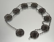 A Japanese cast white metal chrysanthemum nine-panel adjustable chain link belt with hook fastening: