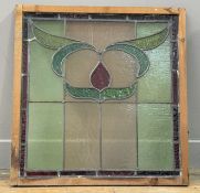 An Art Deco 1920's glass panel, with stained glass panels with geometric design, on wooden frame. (