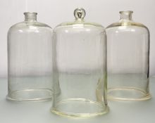 A pair of Apothecary Glass Bell Jars/Cloches (h-40cm) together with a similar smaller glass
