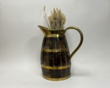 An oak brass mounted barrel jug, complete with dried barley (h. jug 42cm)