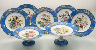 A late 19thc possibly Limoge fruit service, decorated with birds, insects and flowers enclosed