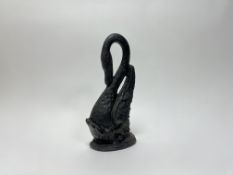 A cast iron door stop in the form of a swan with loop neck 9h. (h. 41cm)
