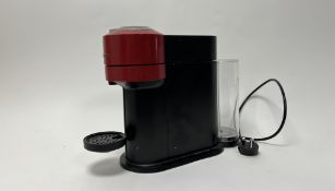 A Nespresso Vertuo Pop Automatic pod coffee machine in red, in working condition with fitted plug