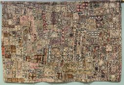 A 20th century Eastern patchwork tapestry, with hand-stitched panels featuring flowerheads and