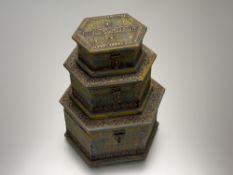 A graduated trio, rustic diamond shaped wooden storage boxes, with hand-painted in mottled green,
