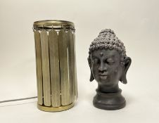 A contemporary moulded plaster Buddha head raised on a circular base (h. 30cm), together with a