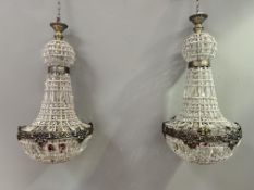 A pair of contemporary metal French Royal Empire style chandeliers with acrylic drops (some drops