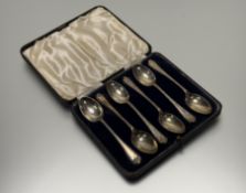 A Birmingham Mappin & Webb set of six Golfing interest coffee spoons in original blue velvet-lined
