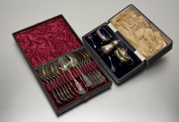 A Walker & Hall Sheffield cased three piece condiment set comprising a pepperette, salt and