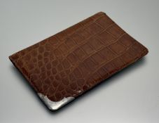 Asprey & Co., a George V silver-mounted crocodile gentleman's wallet, the silver corner mount
