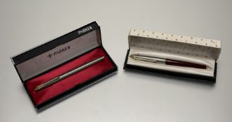A Parker 61 Flighter de Luxe and a Parker 65 maroon Classic de Luxe, in original boxes