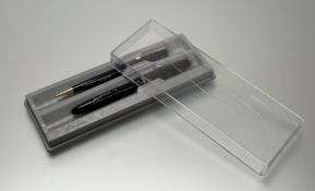 A vintage chalk marked Parker Slimfold fountain pen and pencil set
