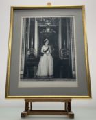 After Anthony Buckley (1912-1993), a signed portrait photograph of H.M. Queen Elizabeth II, dated