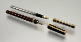 Two vintage S.T. Dupont of Paris fountain pens, to include Montparnasse, with 18k nib
