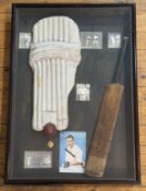 A pair of glazed wall-mounted cased displays of sporting memorabilia: one cricket, including Compton