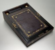 A 19th century brass-bound walnut writing slope, of characteristic form, the gilt-stamped leather