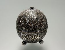An Indian silver string tidy, early 20th century, of spherical form, with elaborate chased