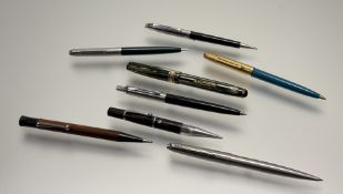 A group of pens including a Parker gilt blue acrylic ballpoint pen, a Parker stainless steel