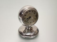 A George V silver desk clock, Charles Perry & Co., Chester 1927, the case of spherical form,
