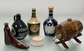 A group of stoneware and pottery of whisky related interest to include a Royal Doulton barrel, a