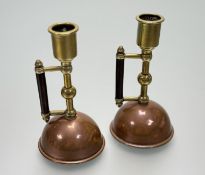 A pair of Arts and Crafts, after Christopher Dresser, Benham & Froud brass and copper candlestick
