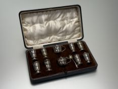A George V Birmingham silver ten-piece condiment set of baluster form, comprising four weighted