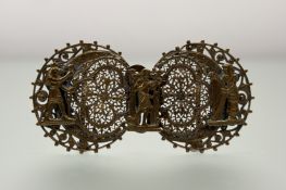A 1920s gilt metal Egyptian revival two-part buckle to include a representation of Thoth and Ithy: