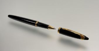 A Waterman black and gilt metal mounted ballpoint pen