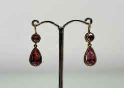 A pair of late 19th yellow metal pink stone drop earrings with circular faceted foil set studs and