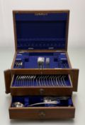 A Walker & Hall Edwardian oak canteen containing a part suite of epns Old English pattern flaware to
